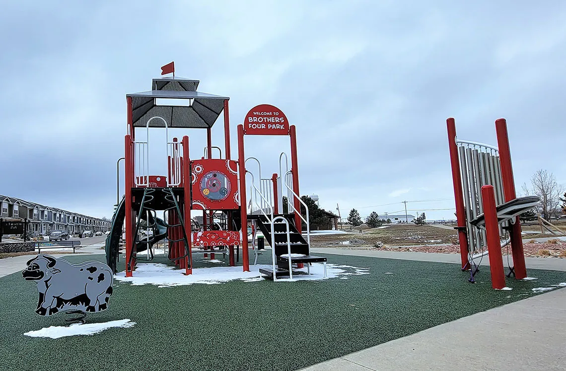 Themed playground with musical instruments outside at Brothers Four Park
